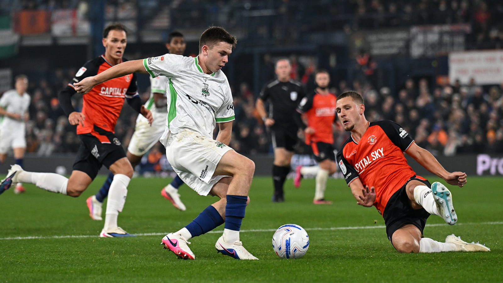 Luton Town and Barnsley players in action